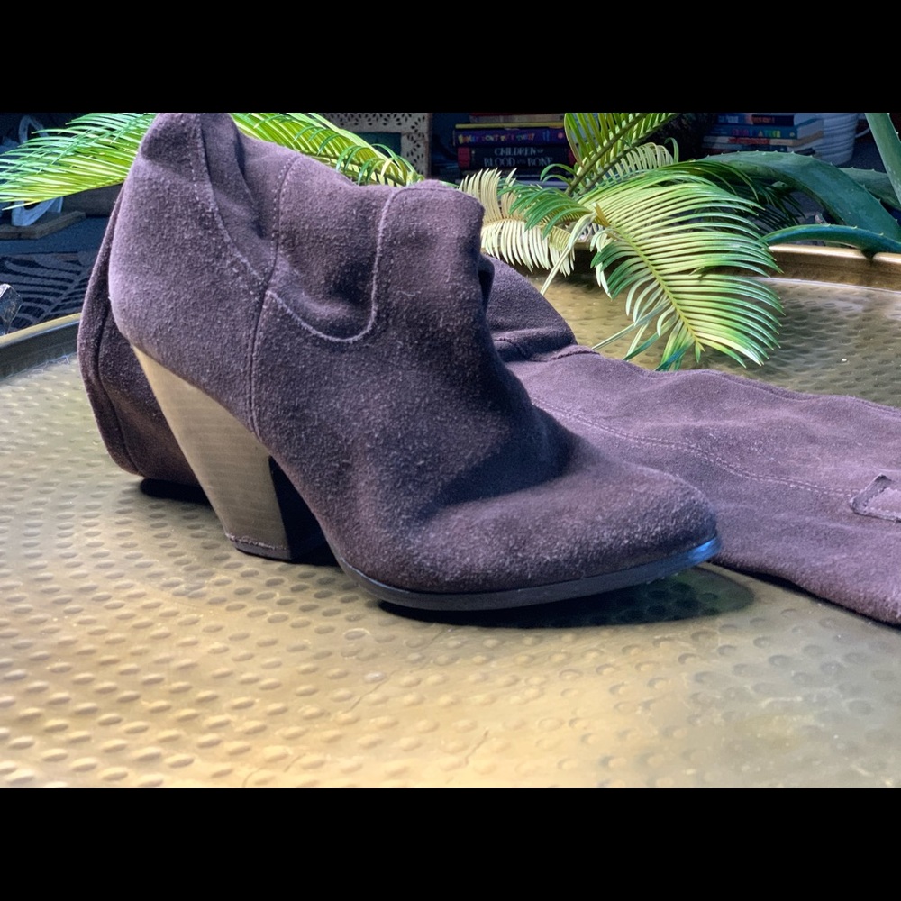 Tall suede brown western boots.